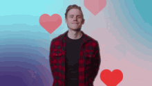 a man in a plaid shirt is surrounded by hearts on a blue and pink background