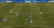 a soccer game is being played on a field with a monster advertisement in the background