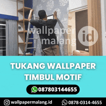 a man on a ladder installing wallpaper in a bedroom