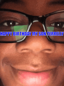 a close up of a person wearing glasses with the words happy birthday my son terrenly