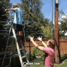 a man standing on a ladder next to a boy on a trampoline with the words c'mon son written on the bottom