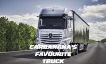 a mercedes truck is driving down a road