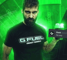 a man with a beard wearing a gfuel energy formula shirt