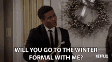 a man in a suit and tie asks if he can go to the winter formal with him