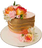 a pink and gold cake with flowers on it