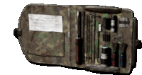 a camouflage wallet with a lot of tools inside