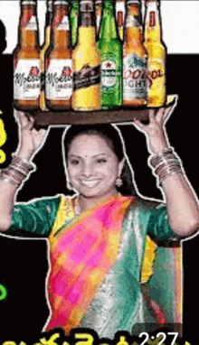 a woman is carrying a tray of beer bottles on her head