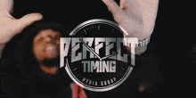 a logo for perfect timing media group with a clock on it