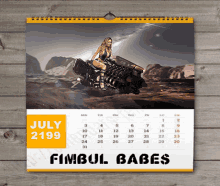 a calendar with a picture of a woman on a motorcycle for july