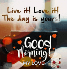 a cup of coffee with hearts and the words " live it love it the day is yours "