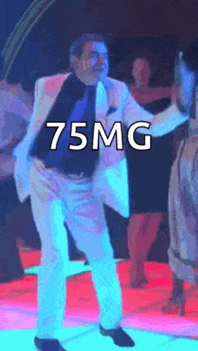 a man in a suit and tie is dancing with the words 75mg written on the bottom