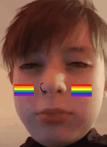 a close up of a person 's face with two rainbow flags on their face