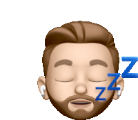 a man with a beard and ear buds is sleeping with the letters zz behind him