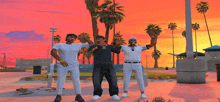 three men are posing for a picture in front of a sunset with a palm tree in the foreground