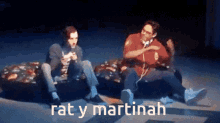 two people sitting on a couch with the words " rat y martinah " written on the bottom