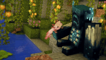 a pink axolotl is laying on a blue block in a minecraft scene