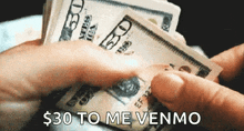 a person holding a pile of money with the words $ 30 to me venmo