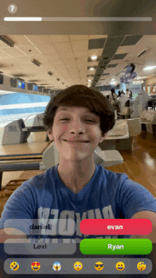 a boy in a bowling alley talking to ryan