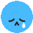 a blue smiley face with a tear coming out of it 's eye .