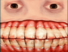 a close up of a person 's mouth and teeth with a big smile