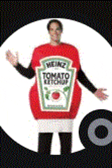 a man is dressed as a tomato ketchup bottle .