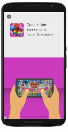 a phone screen shows an advertisement for cookie jam on google play