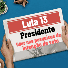 a person is holding a newspaper that says lula 13