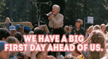 a woman speaking into a megaphone with the words " we have a big first day ahead of us "