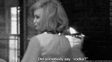 a black and white photo of a woman saying did somebody say vodka .