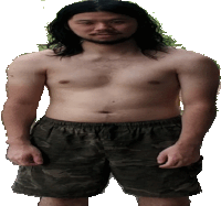 a shirtless man with long hair and a beard wearing camo shorts