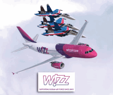 a wizz airplane is flying in the sky with fighter jets