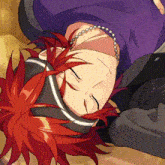 a man with red hair is laying upside down with his eyes closed .