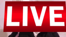 a red sign with the word live in white letters