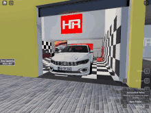 a white car is parked in a garage with a sign that says hr