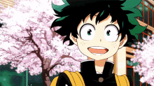 a young boy with green hair is standing in front of a cherry blossom tree .