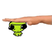 a person 's hand is reaching out towards a cartoon character with sunglasses on .