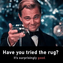 a man in a tuxedo is holding a glass of wine and says have you tried the rug