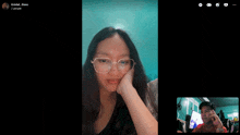 a woman wearing glasses is on a video call with a man named kristel