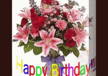 a bouquet of pink flowers in a vase with the words happy birthday written on it