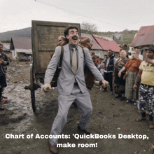 a man in a suit and tie is standing in front of a cart with the words chart of accounts quickbooks desktop make room below him