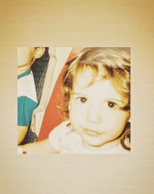 a picture of a young girl with a headband on her head