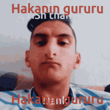 a man 's face is shown with the words " hakann gururu " on the bottom