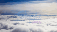 a blue sky with clouds and the word studio in the lower right corner