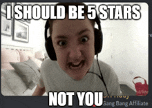 a girl wearing headphones is making a funny face with the caption i should be 5 stars not you