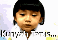 a picture of a little girl with the words kuyah terus written below her