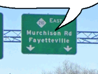 a green highway sign points to murchison rd and fayetteville