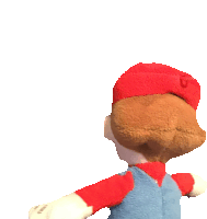 a stuffed animal with a red hat and overalls