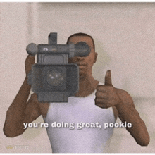 a man is holding a camera and giving a thumbs up with the words you 're doing great pookie below him