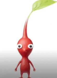 a red cartoon character with a green leaf coming out of it 's head