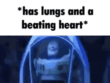 buzz lightyear from toy story is sitting in a capsule with the words `` has lungs and a beating heart '' .